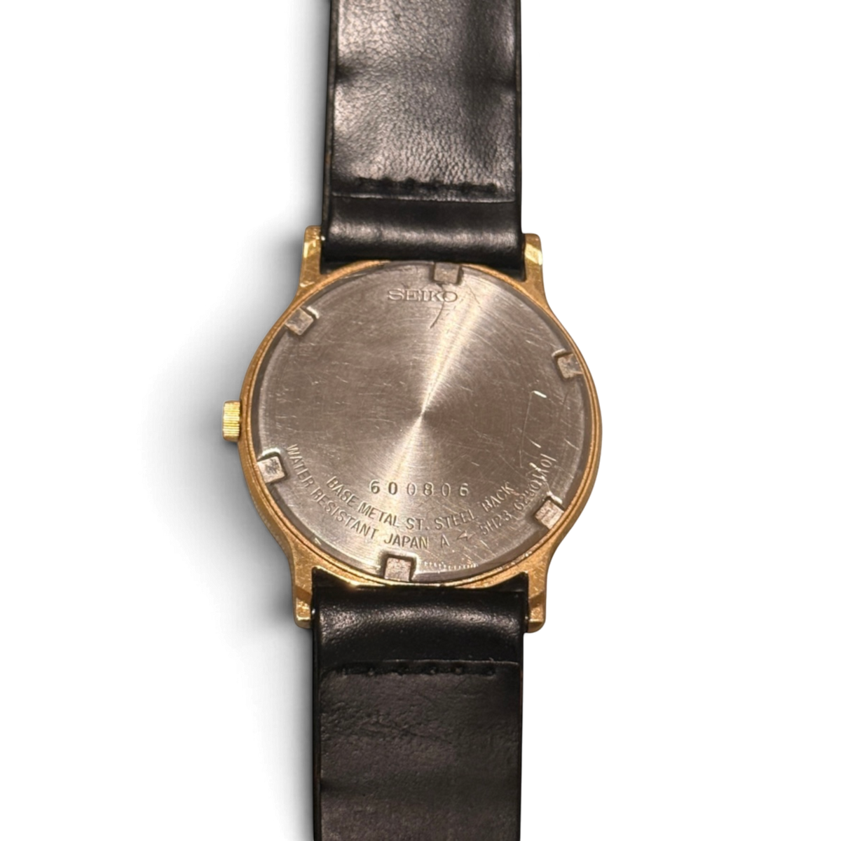 La tapa trasera del Seiko SQ 5H23-6280, con la marca Water Resistant Japan A y el número de serie 600806